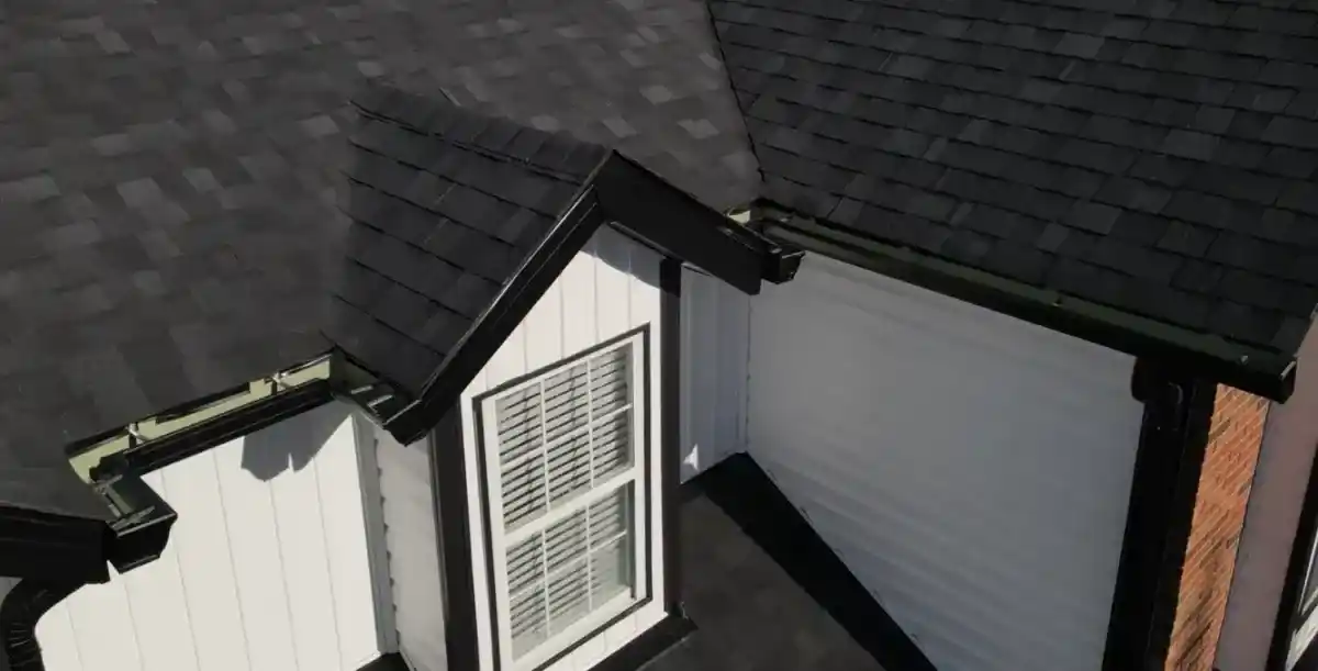 Newly installed seamless gutters protecting a residential home from water damage in St. Louis