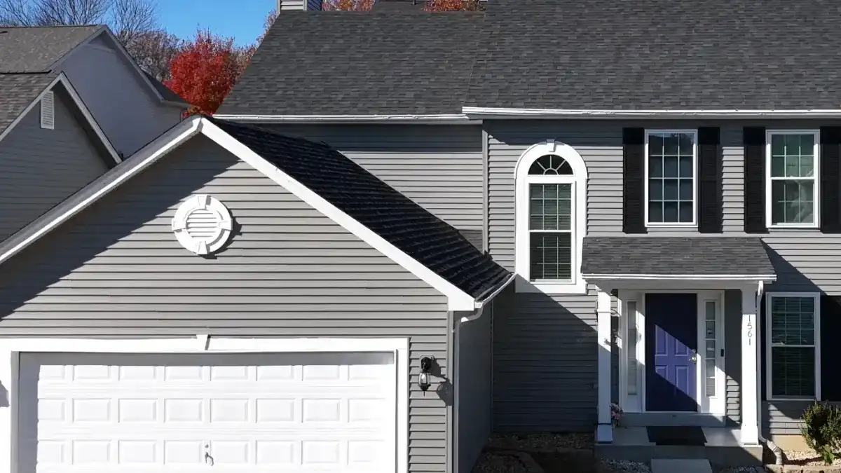 Completed siding installation on a two-storey home with a new roof