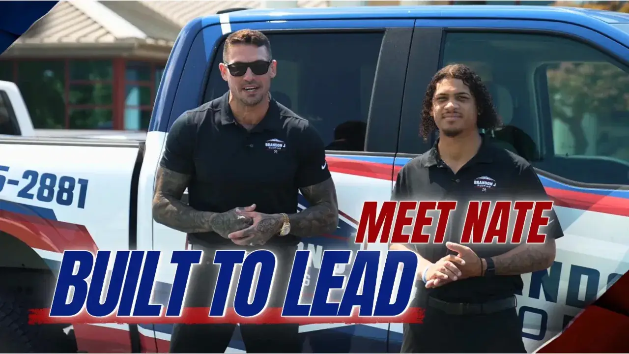 Brandon J Roofing owner Brandon and Nate Desemone standing in front of a branded company truck